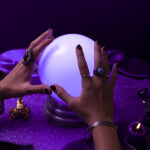 high angle hands holding crystal ball